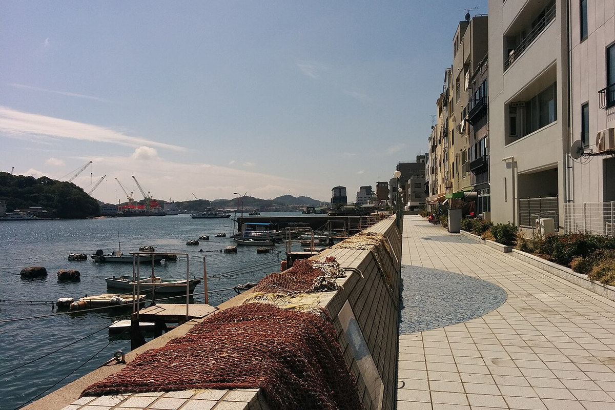 Modern view of Onomichi harbor and hillside architecture used for visual comparison