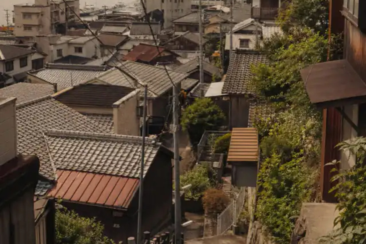 Onomichi hillside neighborhood overlooking tiled roofs and the Seto Inland Sea